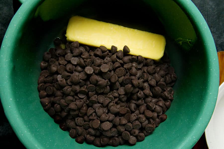 chocolate chips and butter in a green bowl