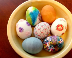 colored Easter eggs in a yellow bowl