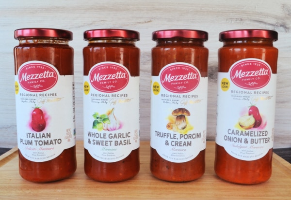 four jars of different flavors of Mezzetta marinara sauce