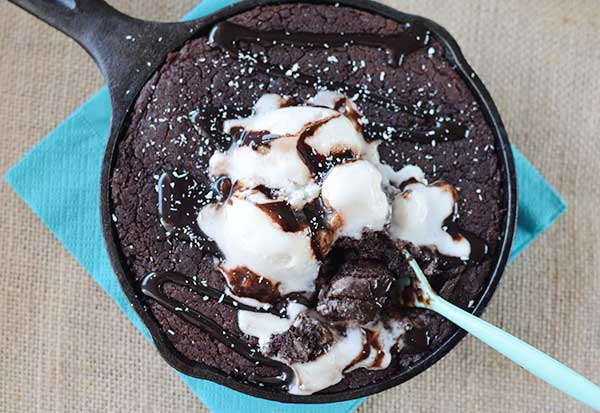 chocolate skillet brownie with a spoon in it