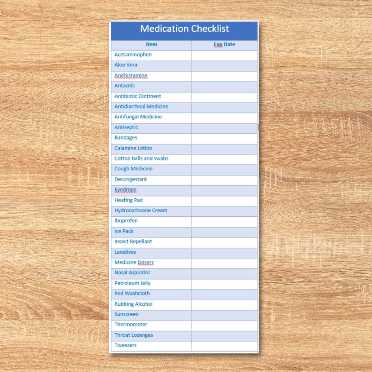 A printed medication checklist with a list of items and columns for names and expiration dates, perfect for organizing your medicine cabinet, placed on a wooden surface.
