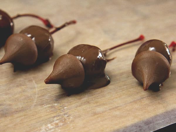 a Hershey's kiss on a chocolate covered cherry