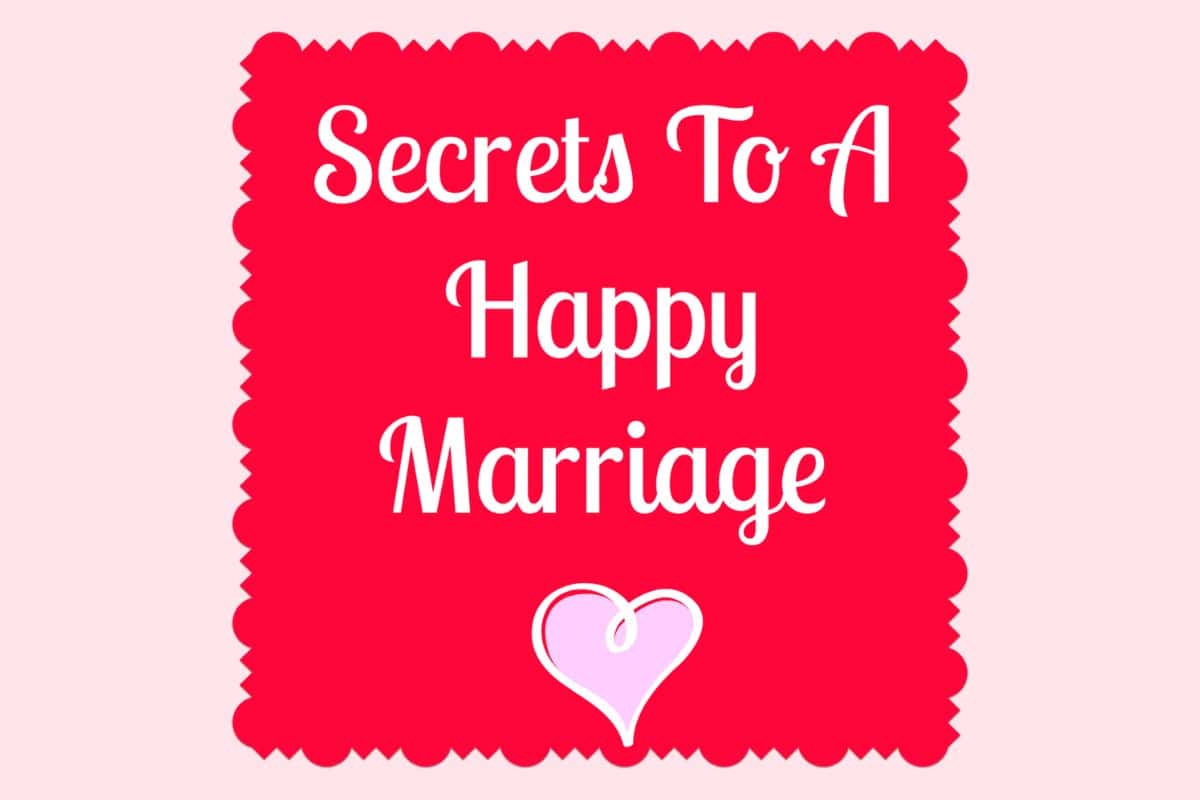 Red square with scalloped edges displaying the white text "Secrets To A Happy Marriage" above a pink heart, perfect for anyone seeking tips for a happy marriage, all set on a light pink background.