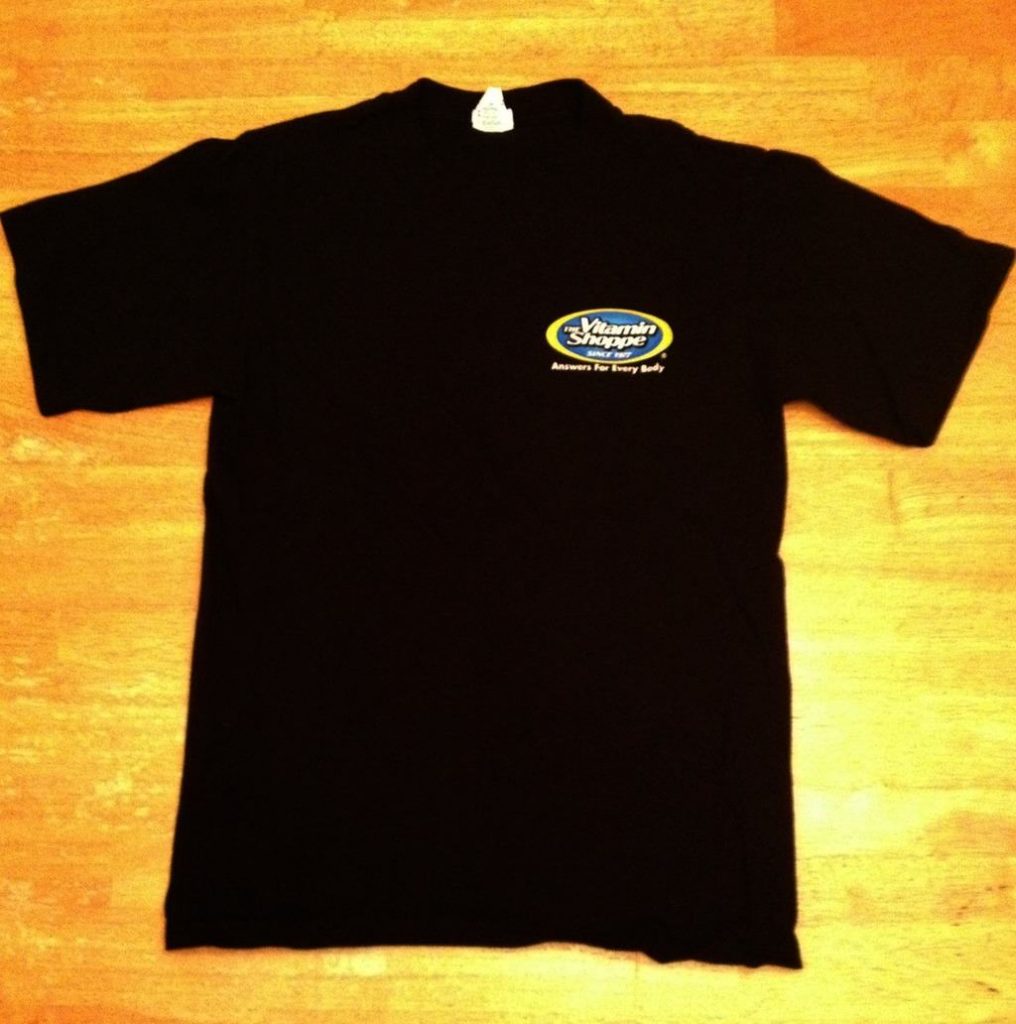 a black T-Shirt on a brown table
