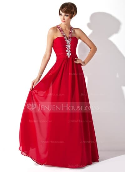 a lady wearing a red prom dress