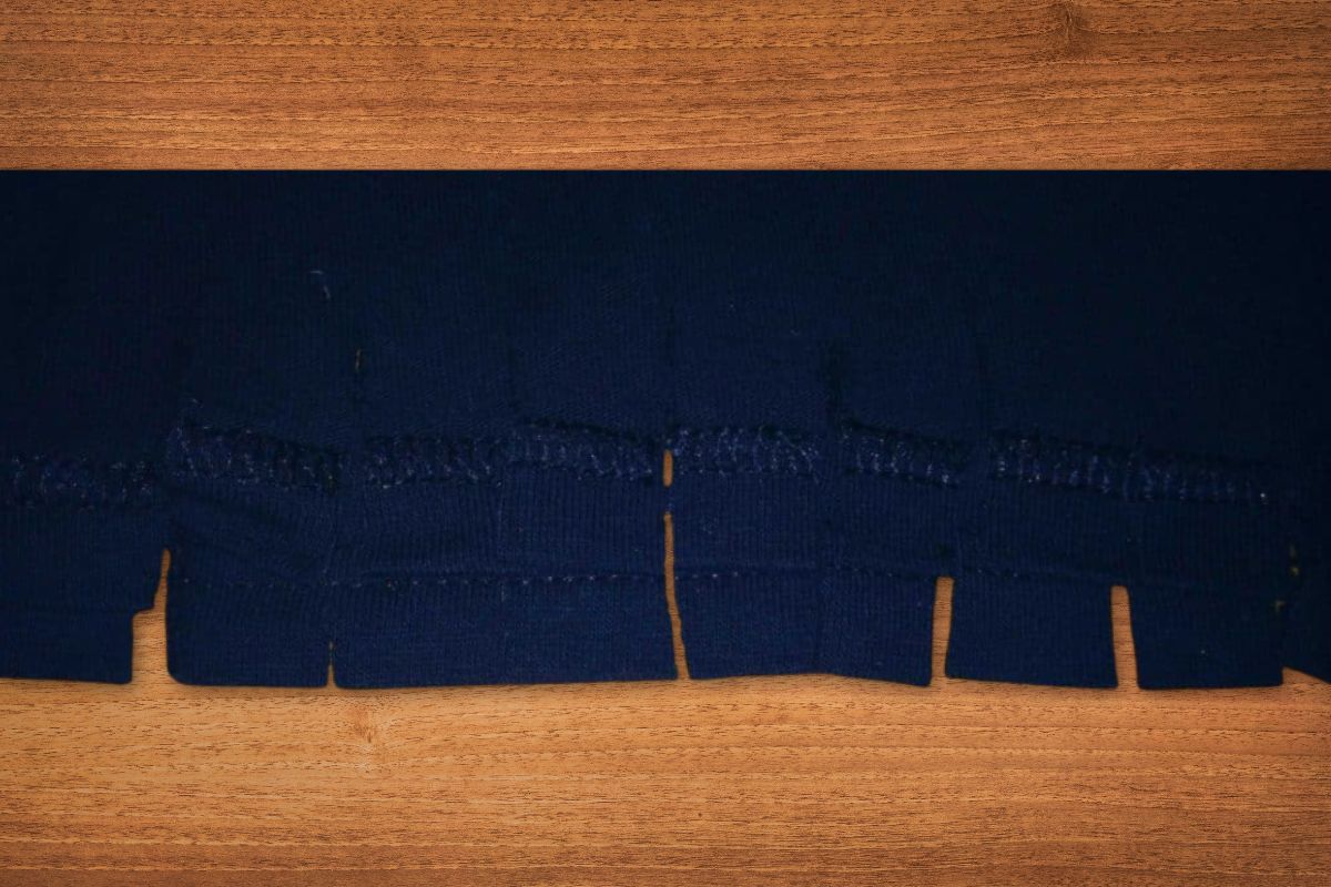 Fringe cut in the bottom of a t-shirt.