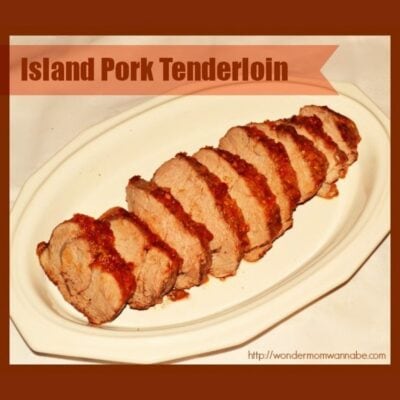 Sliced island pork tenderloin with a reddish sauce arranged on a white oval plate, presented under the heading "Island Pork Tenderloin.