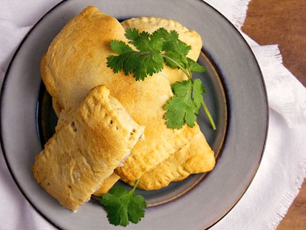 overhead view of turkey turnovers stacked on a plate
