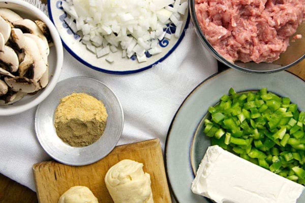 Ingredients in bowls needed for ground turkey turnovers.