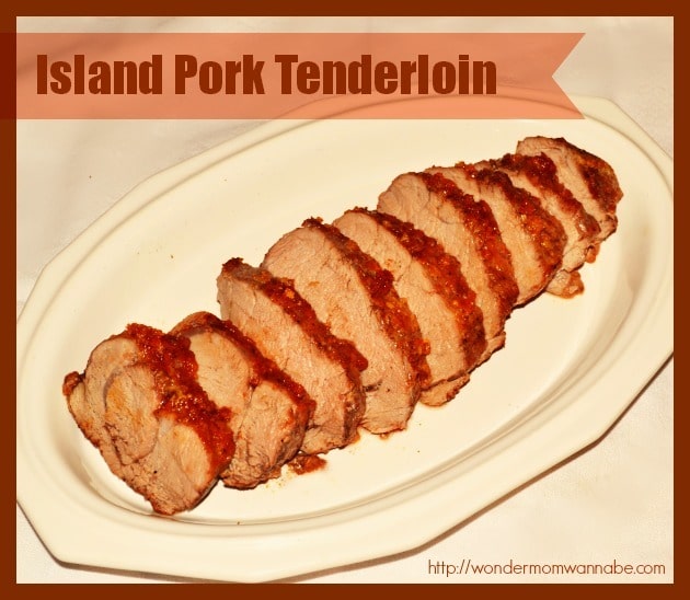 sliced pork tenderloin on a white platter with title text reading Island Pork Tenderloin