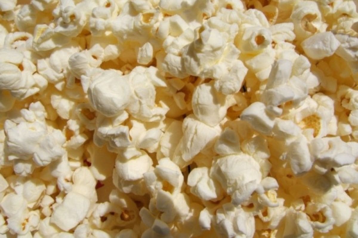 Close-up view of a pile of plain, popped popcorn kernels, perfect for experimenting with new popcorn topping ideas.