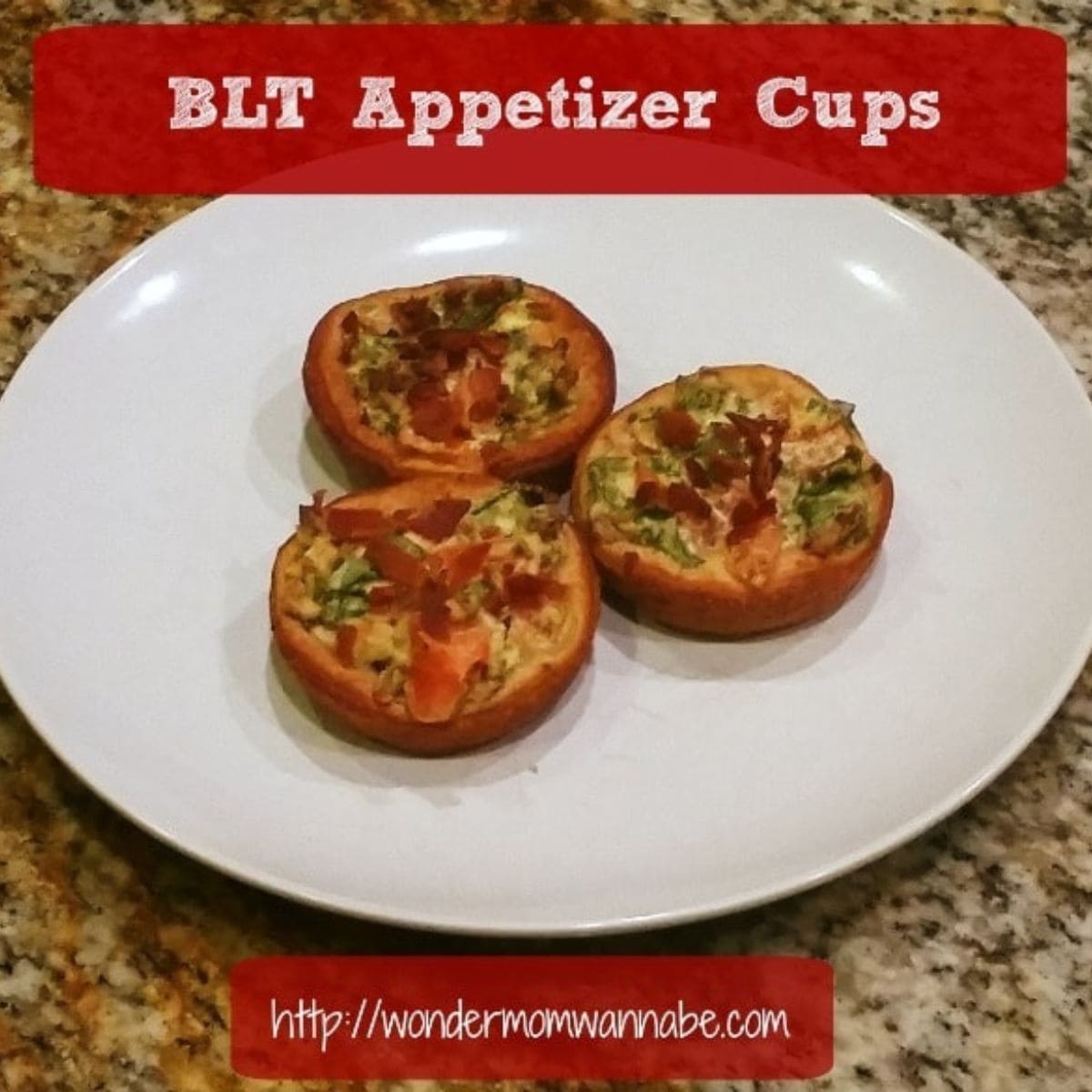 Three BLT appetizer cups are arranged on a white plate, placed on a granite countertop. Text overlay reads "BLT Appetizer Cup" and "http://wondermomwannabe.com".