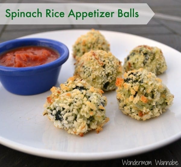 Spinach Rice Appetizer Balls next to a blue bowl of sauce on a white plate with title text reading Spinach Rice Appetizer Balls