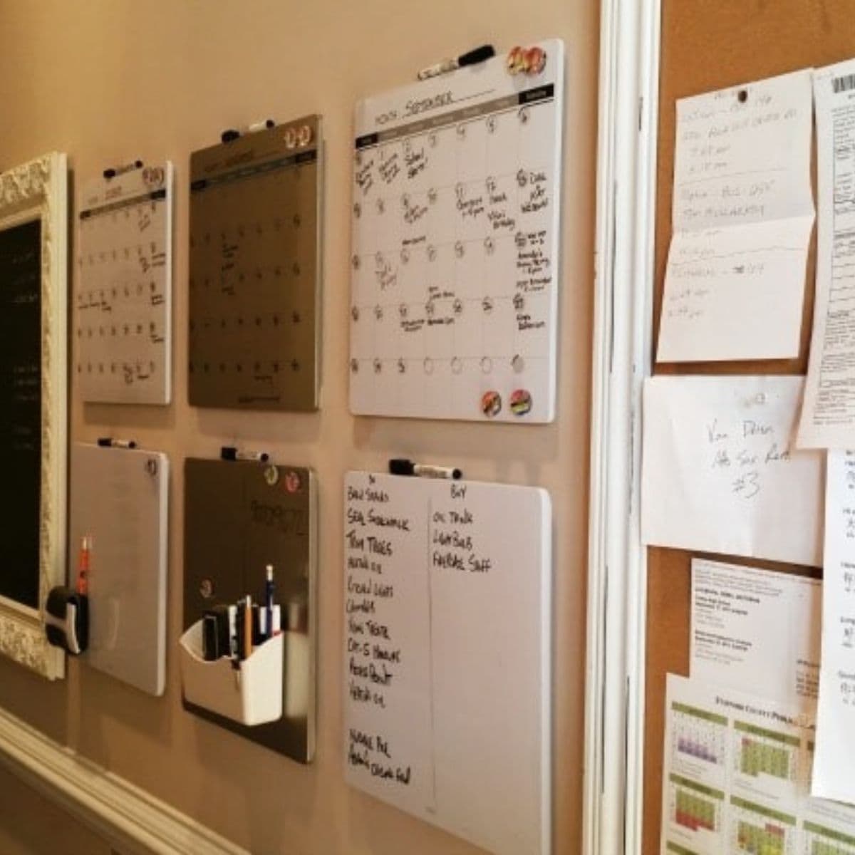 A wall with several whiteboard calendars and organizers, alongside a corkboard holding notes and papers, creates an organized home space perfect for planning and scheduling.