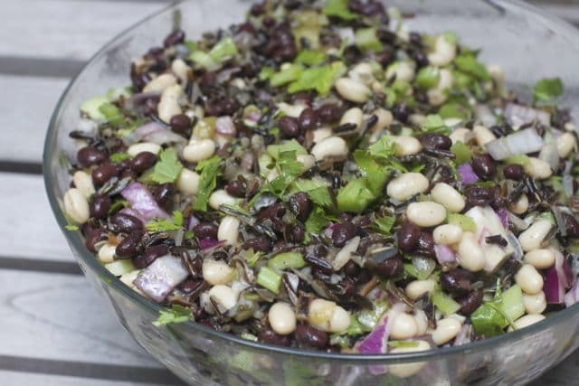 wild rice and bean salad in a glass bowl