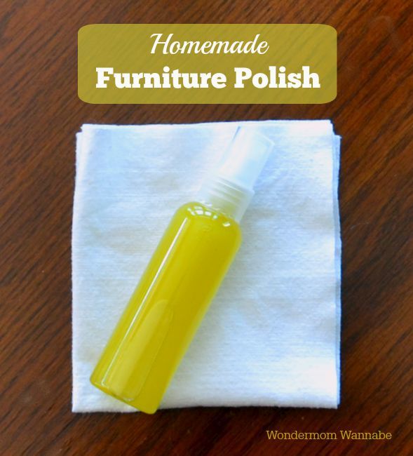 Homemade Furniture Polish in a small bottle on a white cloth on a brown table with title text reading Homemade Furniture Polish