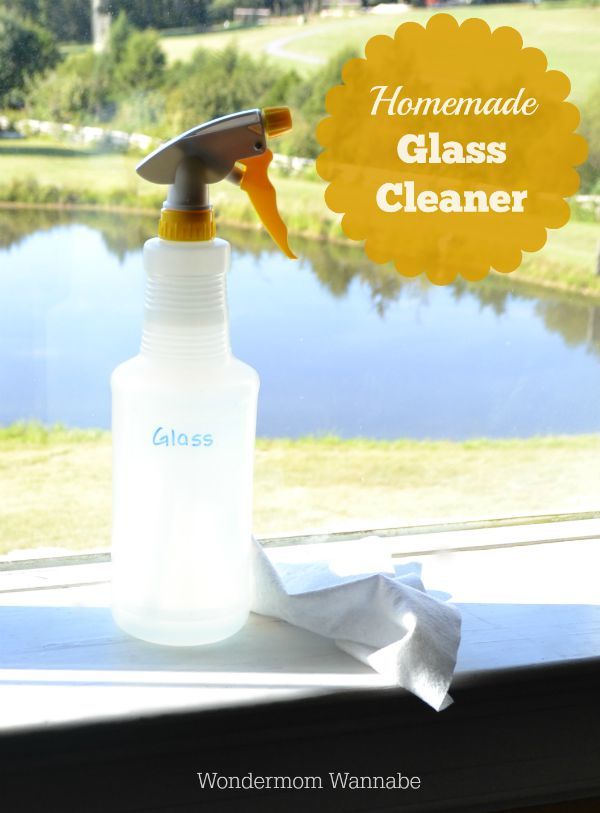 Homemade Glass Cleaner in a spray bottle next to a window