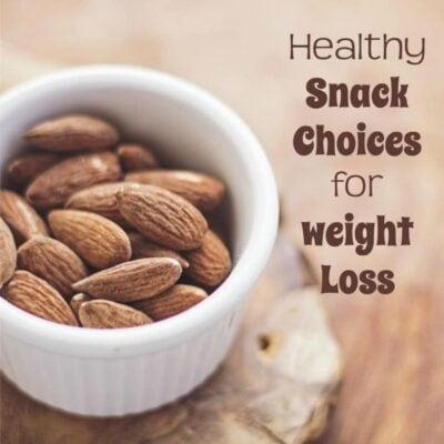 A white bowl filled with whole almonds sits on a wooden surface; text reads "Healthy Snack Choices for Weight Loss" to inspire smart snacking habits.