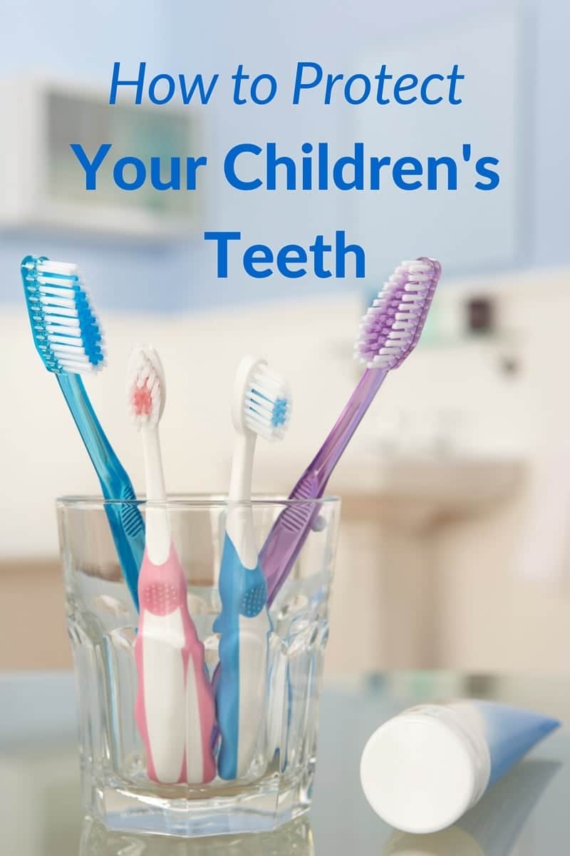 four tootbrushes in a glass cup with a tube of toothpaste next to it with title text reading How to Protect Your Children's Teeth