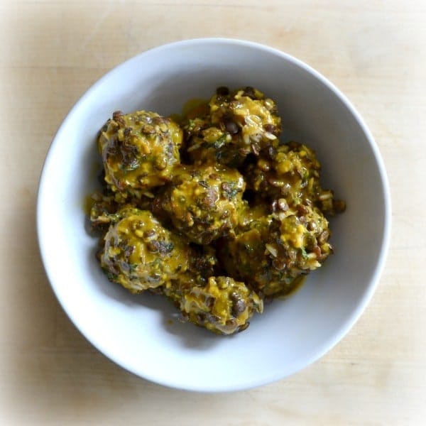 Tangy Vegan Meatballs made with lentils and covered in a simple mustard sauce