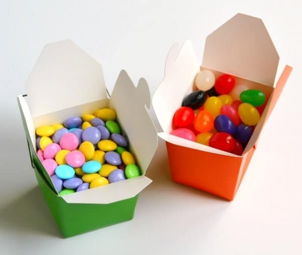 take out boxes filled with m&ms and jelly beans as Treats for an Easter care package for college students