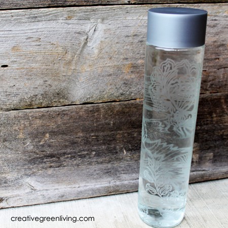 DIY etched glass water bottle with a wood background