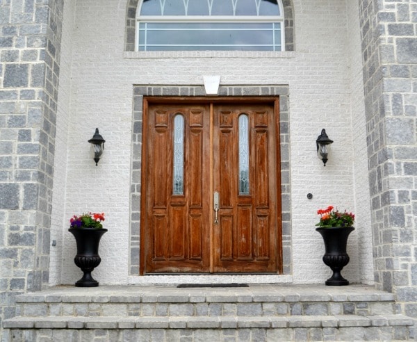 Front entrance with planter urns