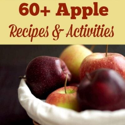 A basket with assorted red and green apples sits below a sign reading "60+ Apple Recipes & Activities," perfect for discovering new apple recipes and activities.