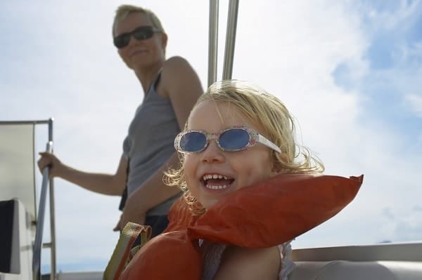 a mom and daughter on a boat