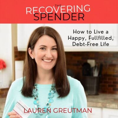 A woman holding a credit card smiles in her kitchen; the image highlights "The Recovering Spender" by Lauren Greutman, an inspiring guide to living a happy, fulfilled, debt-free life.