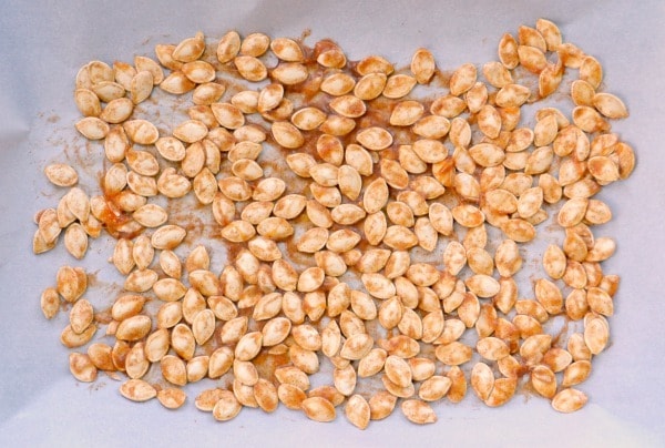 ready-to-bake-pumpkin-seeds on parchment paper