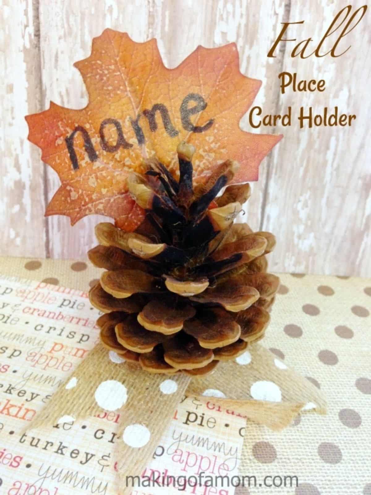 Easy fall place card holder with a pine cone, perfect for Thanksgiving decor ideas.