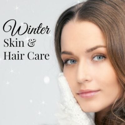 A woman in a white sweater touches her face, with "Winter Skin & Hair Care" beside her on a light, snowy background—highlighting the importance of winter skin and hair care.