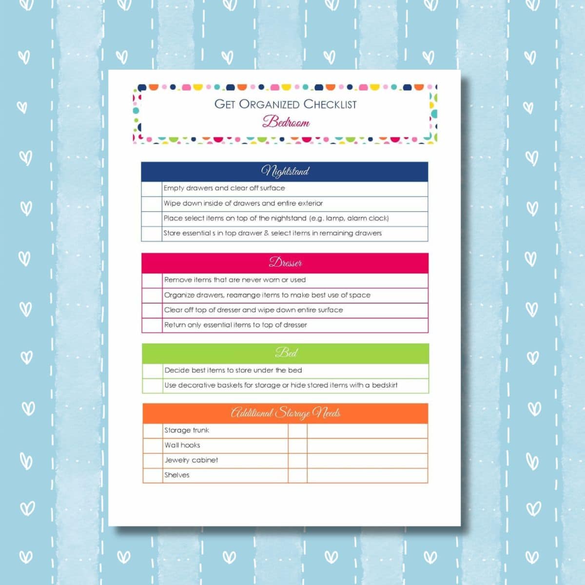 A printed get organized checklist for your bedroom, featuring organizing tasks for the nightstand, dresser, bed, and storage needs—all set on a blue background with heart patterns.