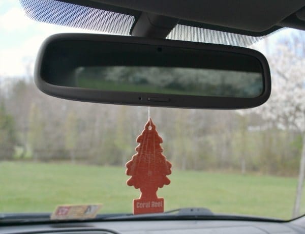a car air freshener hanging from a rear view mirror
