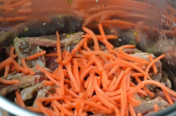 Instant Pot Korean Short Ribs tipped with shredded carrots