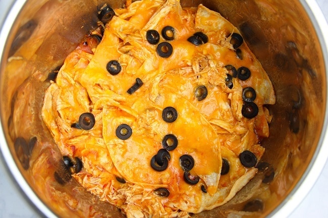 shredded chicken and enchilada sauce, shredded cheese, olives, tortillas in an instant pot