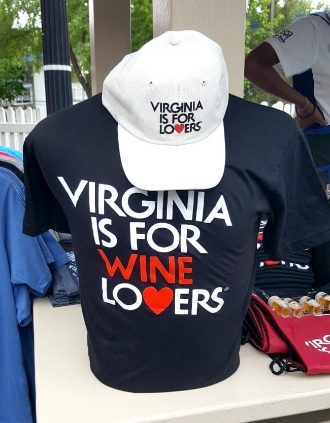 a shirt and hat on display in a store with text reading Virginia is for wine lovers