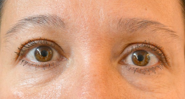 a closeup of a lady's eyes after applying mascara