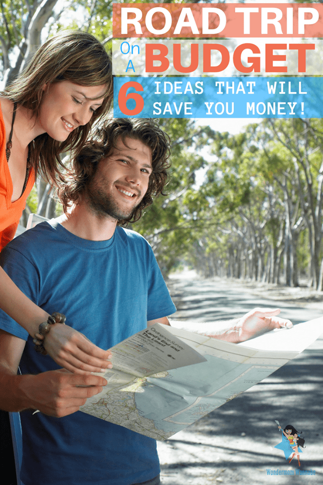 a man and woman looking at a map standing on a road outside with title text reading Road Trip On A Budget 6 Ideas That Will Save You Money!