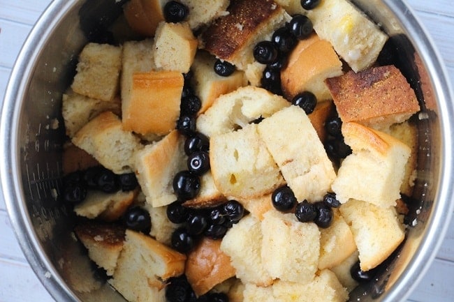 bread cubes, blueberry and egg mixture in an instant pot