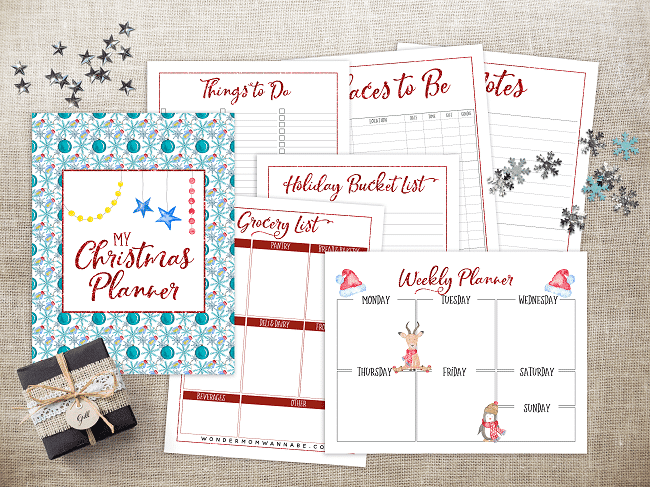 My Christmas planner printable and other Christmas printables with silver stars, snowflakes and a present on top of the pages, all on a brown background