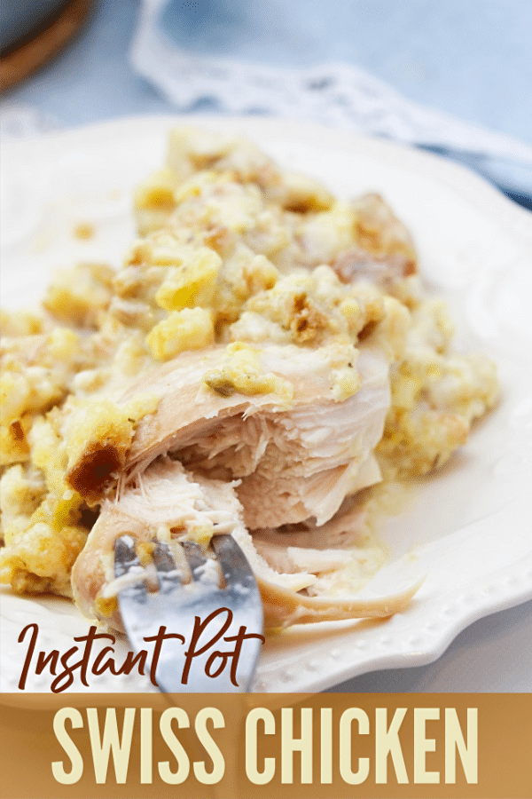 swiss chicken with a fork in it on a white plate with title text reading Instant Pot Swiss Chicken