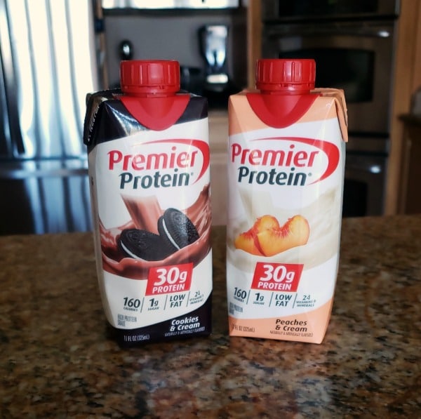 two premier protein drinks on a kitchen counter with the rest of the kitchen in the background