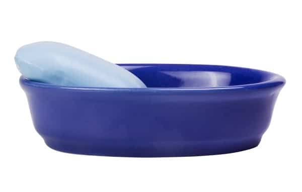 blue bar soap in a blue soap dish