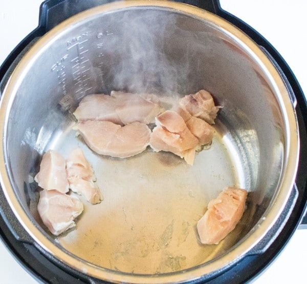 chicken pieces cooking in an instant pot