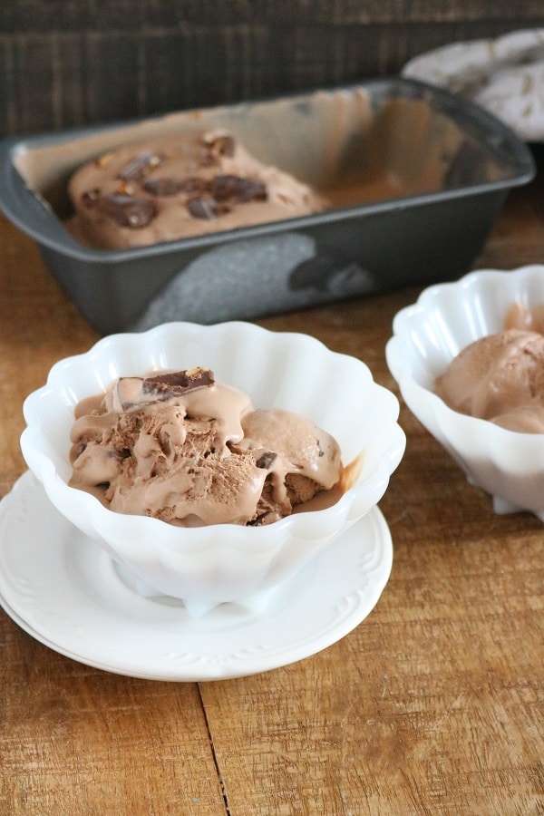a collage of chocolate ice cream in white bowls, one on a white saucer, on a brown table with more chocolate ice cream in a metal pan in the background