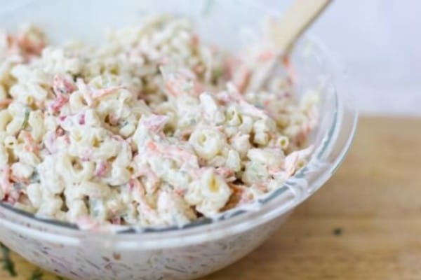 elbow macaroni salad in a bowl on a wood table