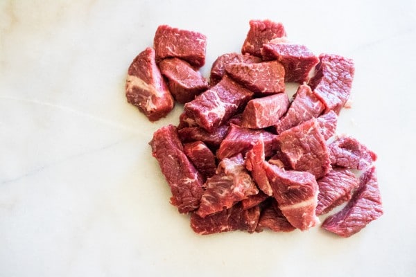 sliced raw beef on a white background