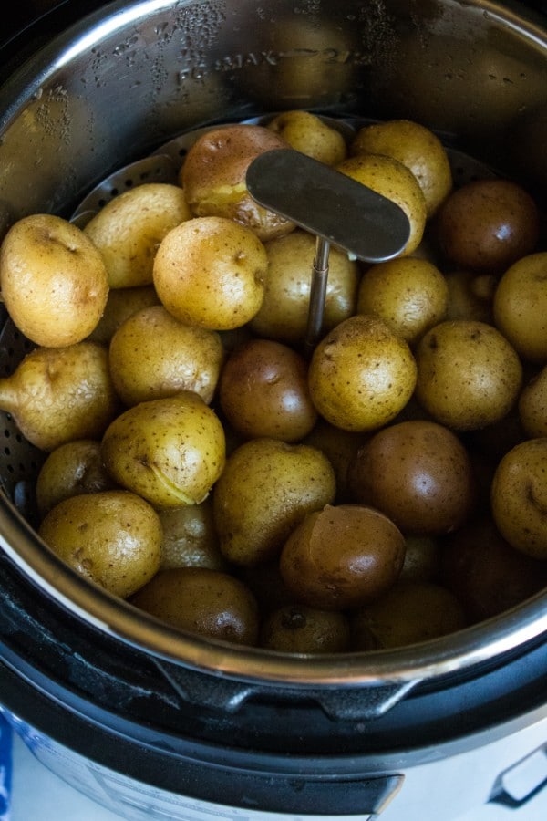 a steamer basket of potatoes in an instant pot